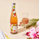 Homare “Strawberry” Nigori flavored nigori with a champagne flute