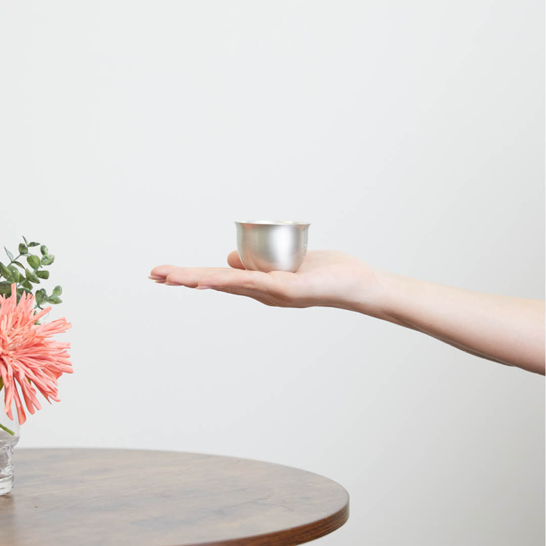 “Hana” Tin Guinomi Cup (With Flower Detail), on a hand