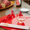 “Nishiki” Gold Flake Guinomi Glass (Clear), on a table
